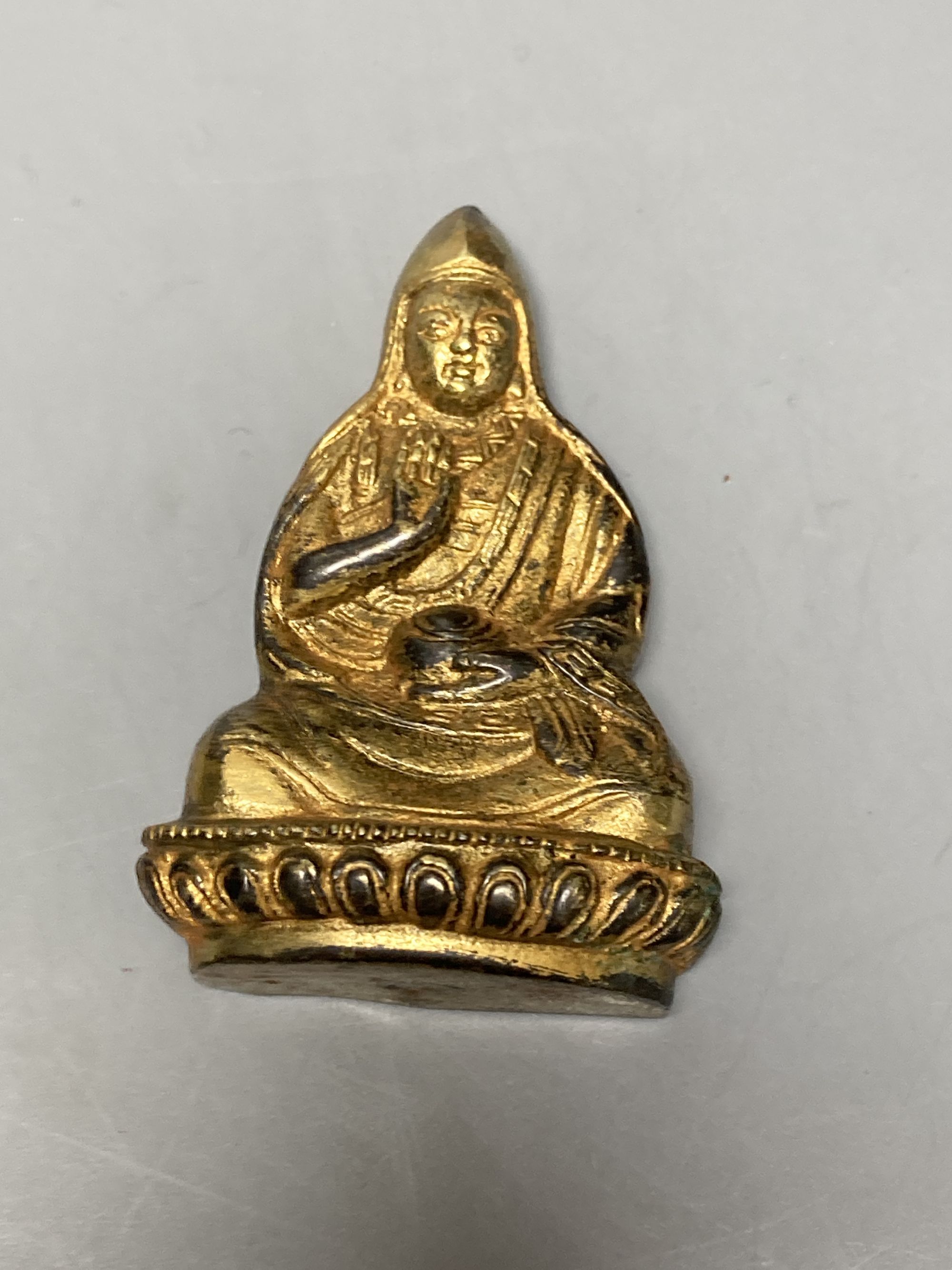 A Chinese seal, Chinese or Tibetan gilt bronze Buddha, etc.